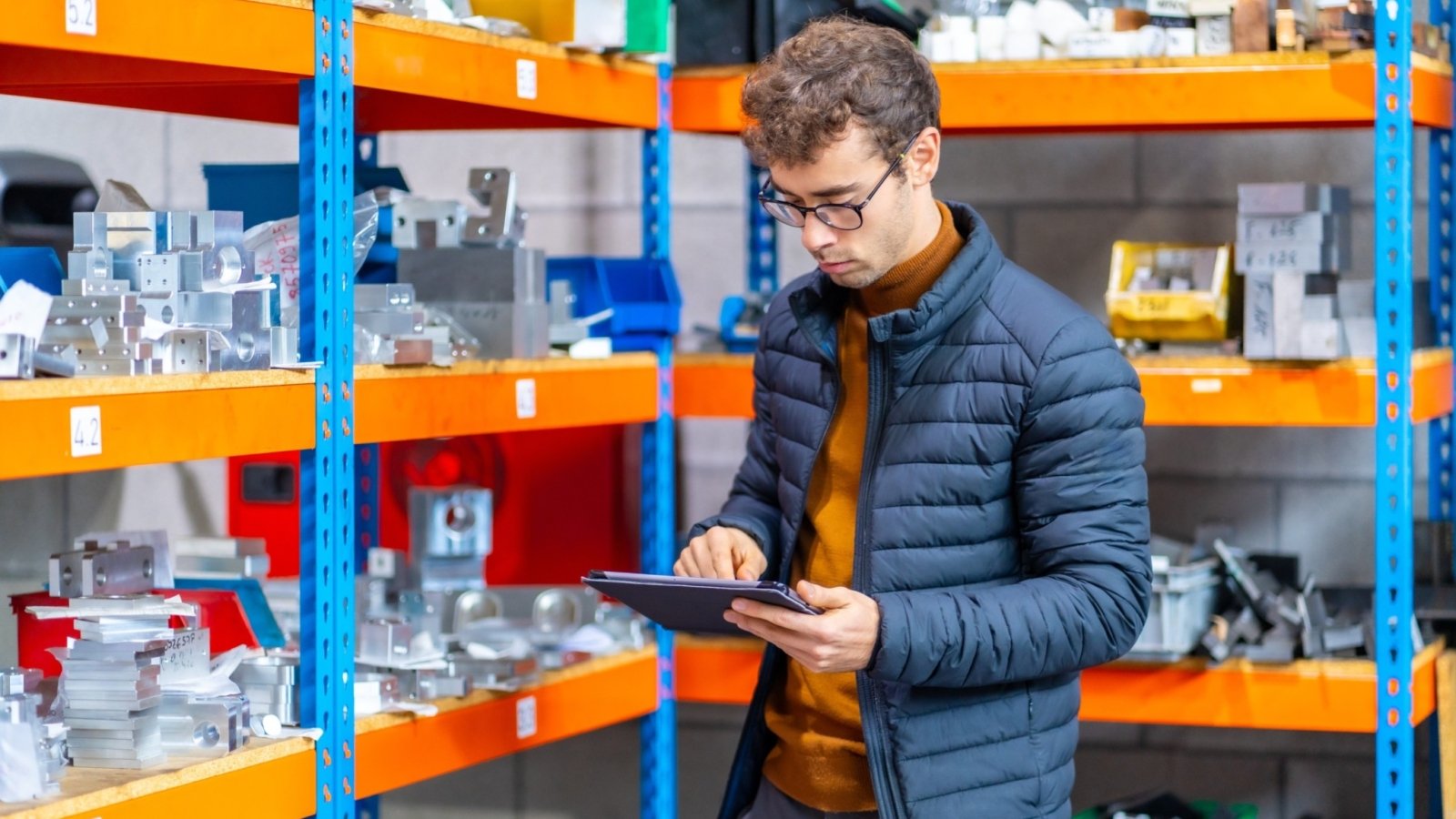 engineer-using-tablet-in-the-warehouse-of-a-cnc-fa-8S7FBVK